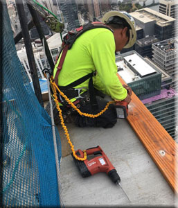TFW Roofing Expert Working On 58 Story Busil